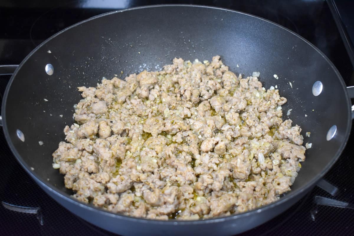 An image of the browned sausage in the skillet.