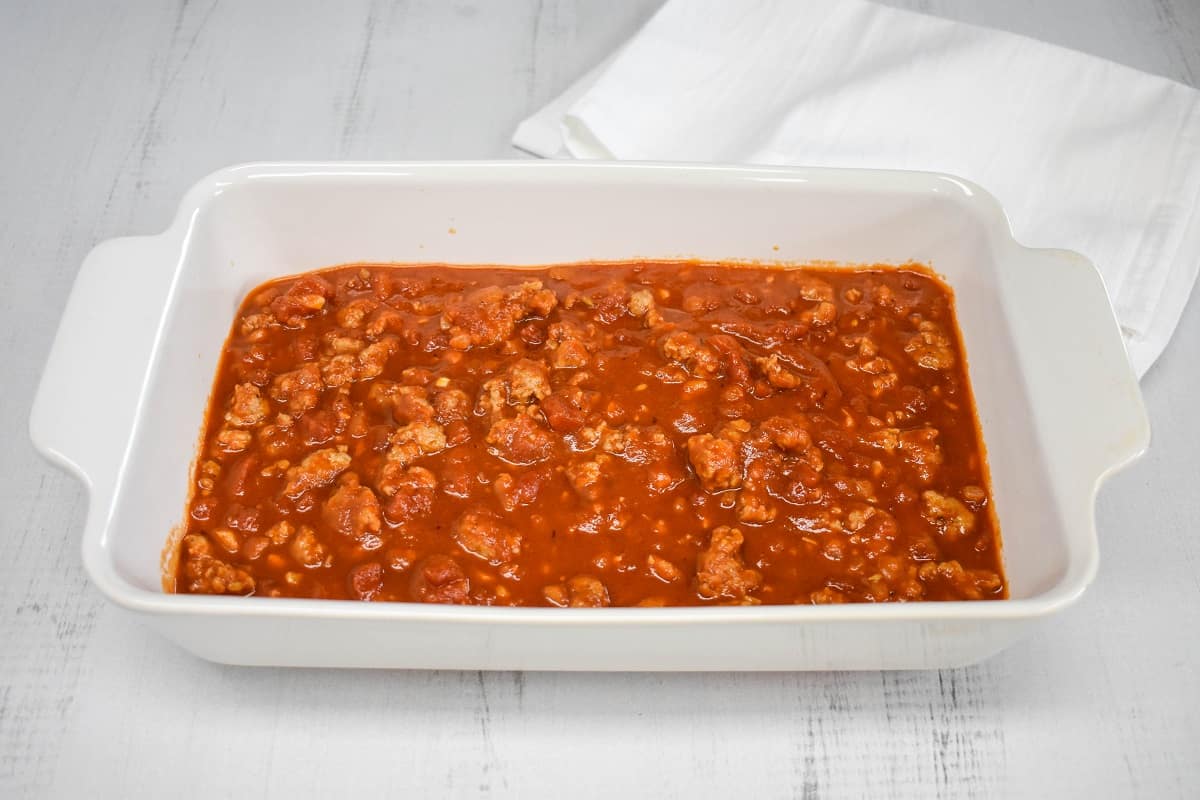 An image of the Italian sausage sauce in a white casserole dish.