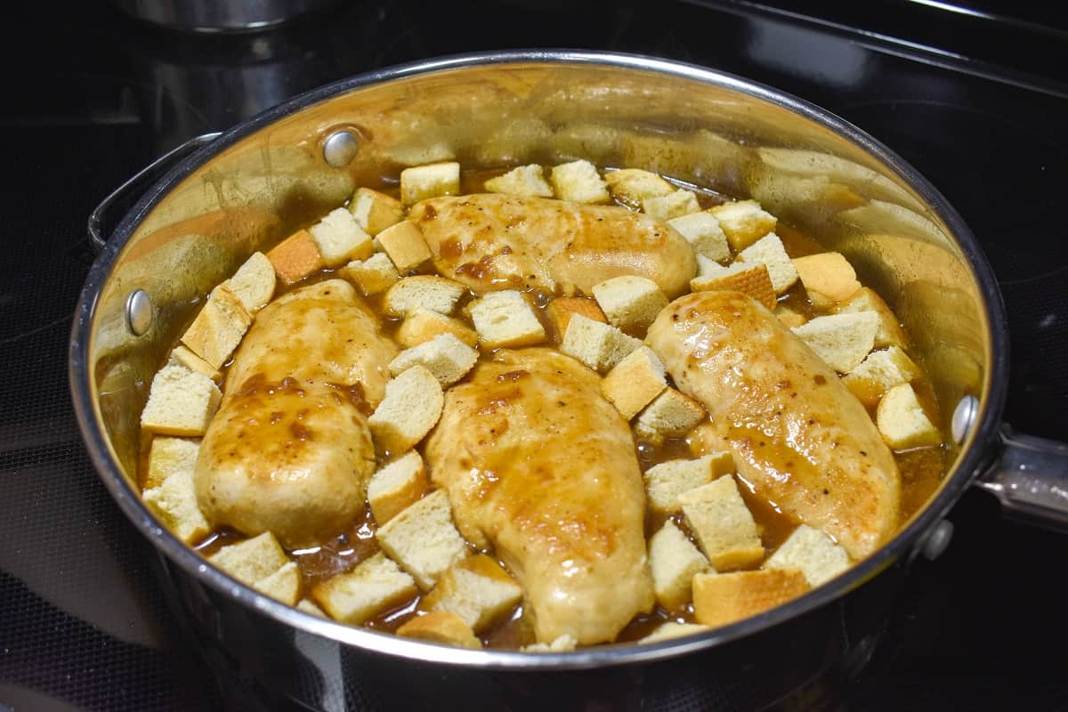 The bread cubes added to the empty spaces around the chicken.