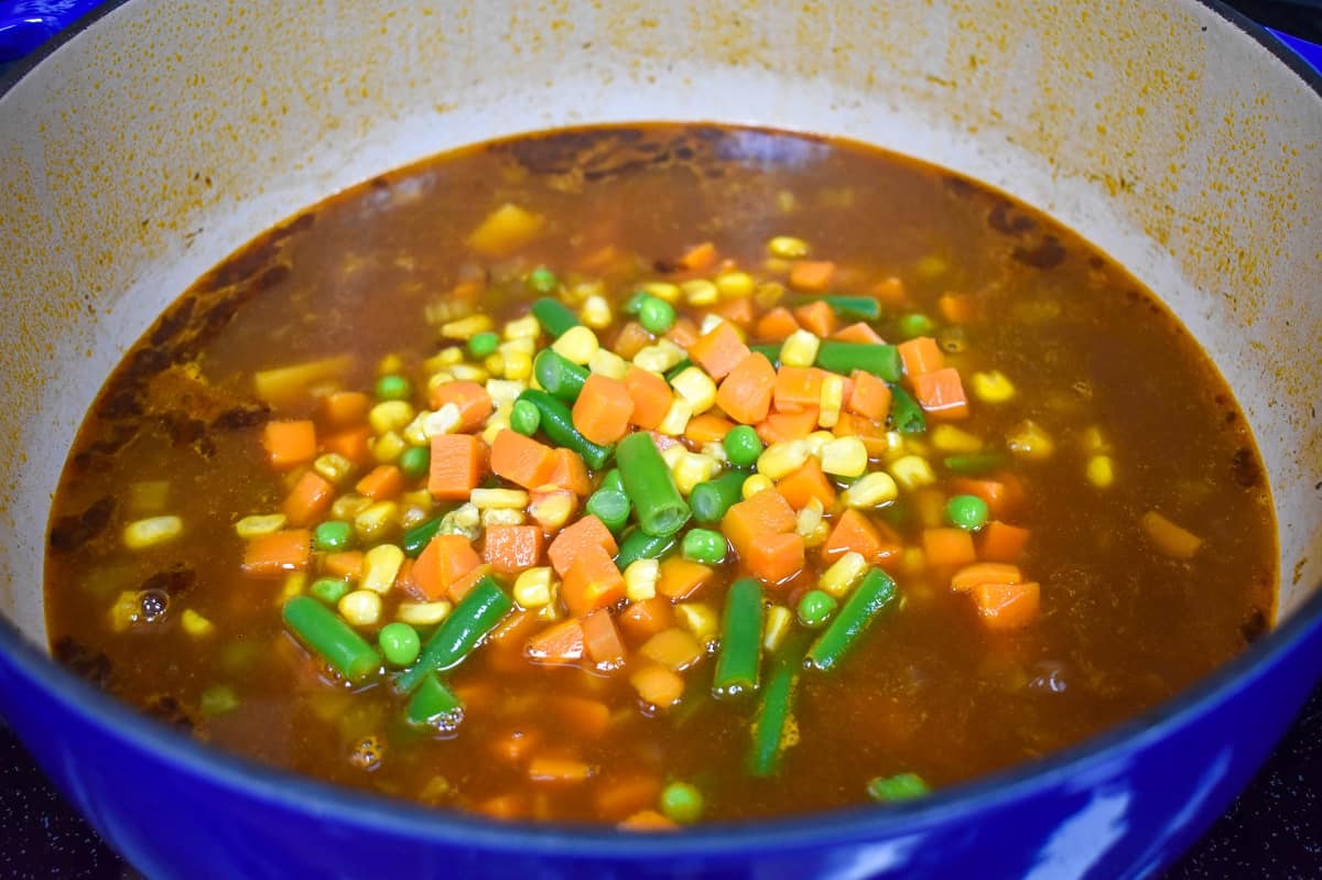 Mixed vegetables added to the soup.