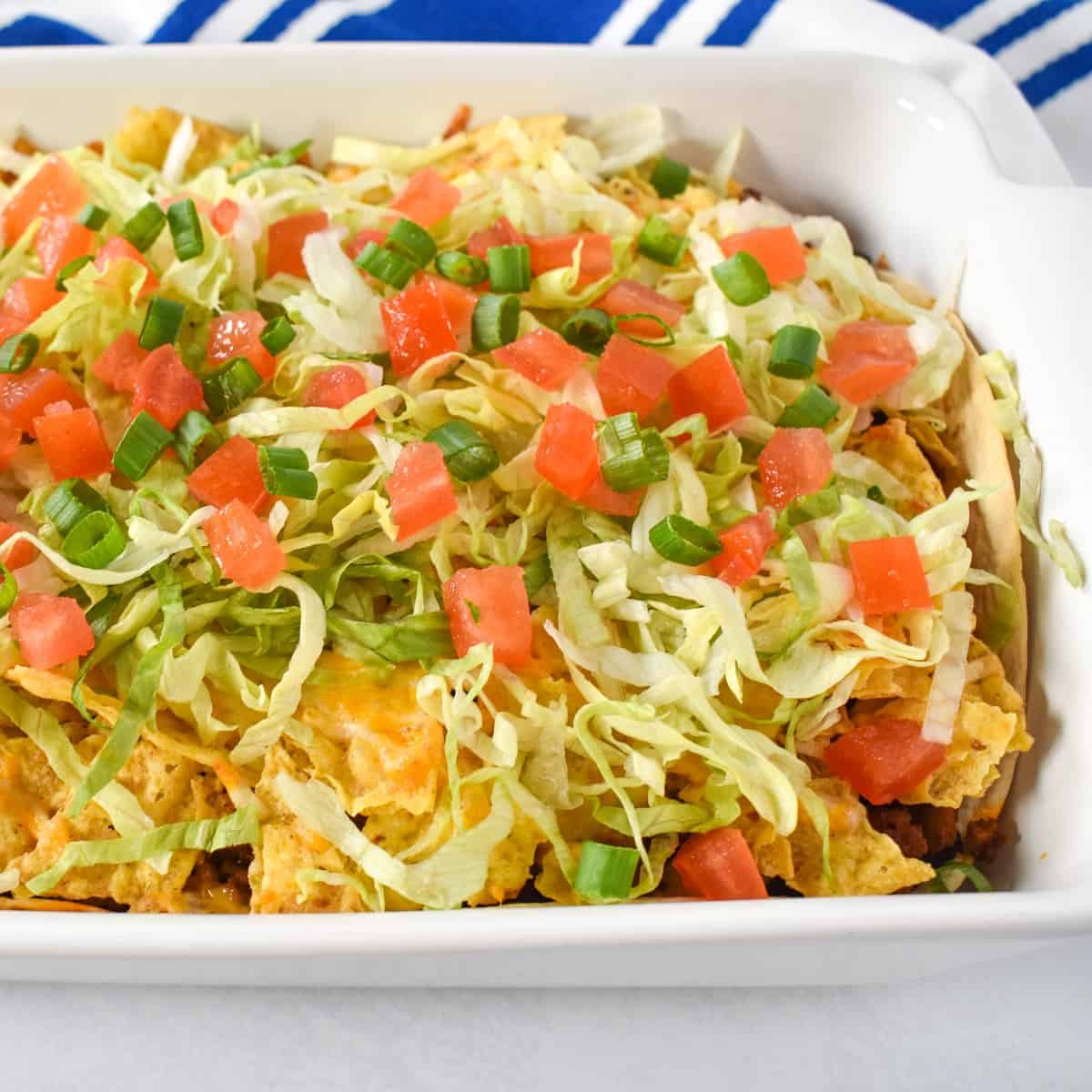 The taco casserole in a white baking dish.