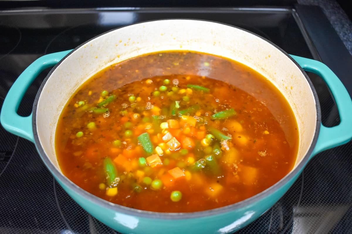 The mixed vegetables added to the pot with the other ingredients.