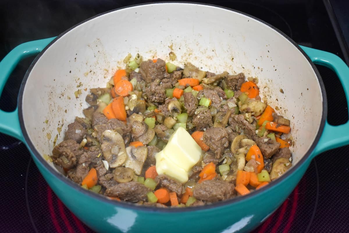 Butter added to the rest of the ingredients in the pot.