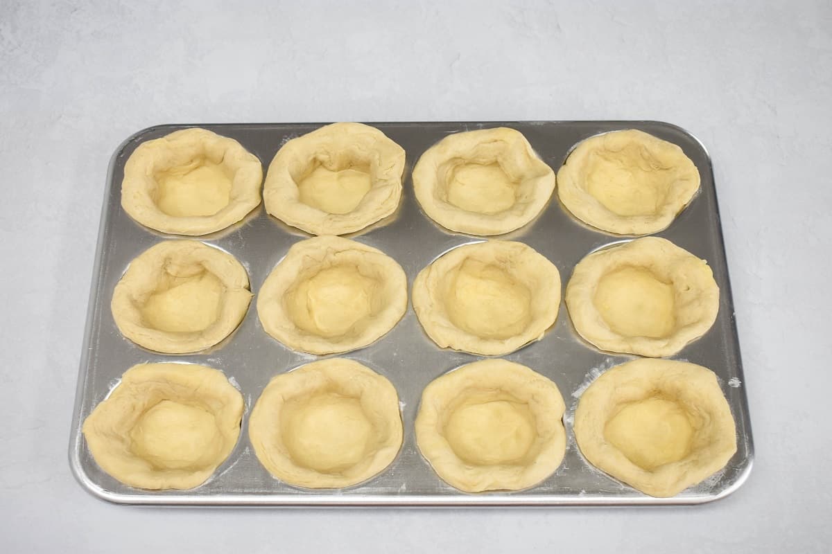 A muffin pan with biscuits molded in.