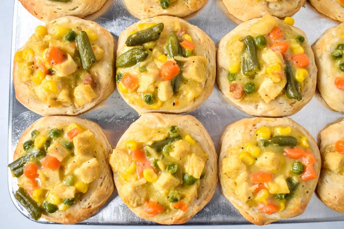 The baked chicken pot pies in the muffin tin.