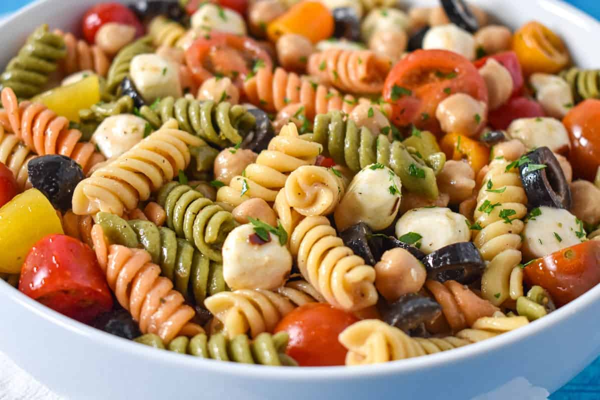 A close-up of the chickpea pasta salad served in a white bowl.