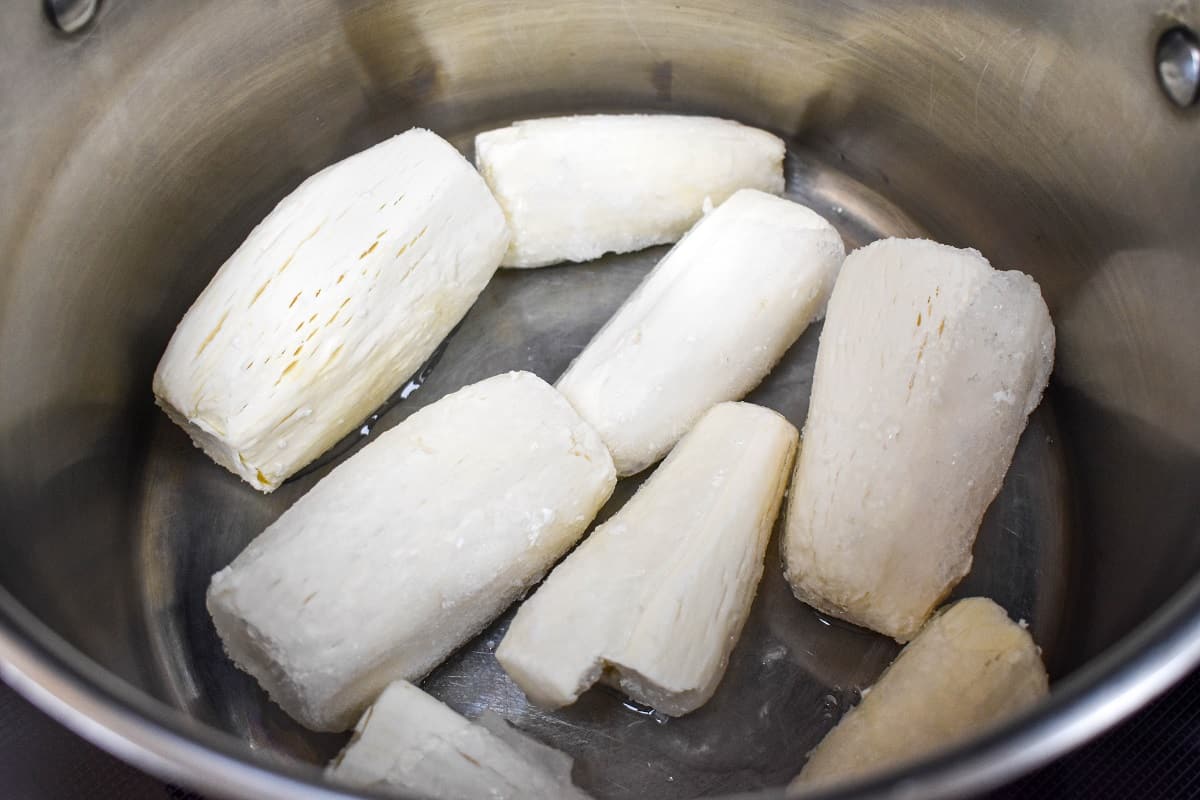 Yuca pieces in a large pot.