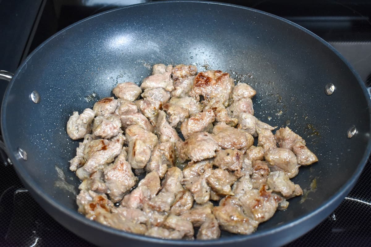 Steak tips in a large, non-stick skillet after browning.