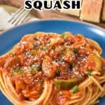 The finished spaghetti sauce with squash served on a blue plate with the title in the top middle in white and black letters.