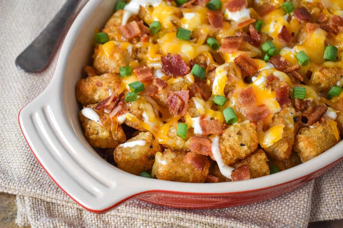 The finished tater tots casserole garnished with green onions.