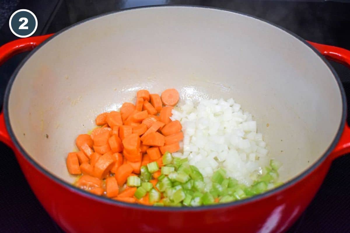 Diced carrots, celery, and onions added to the pot.