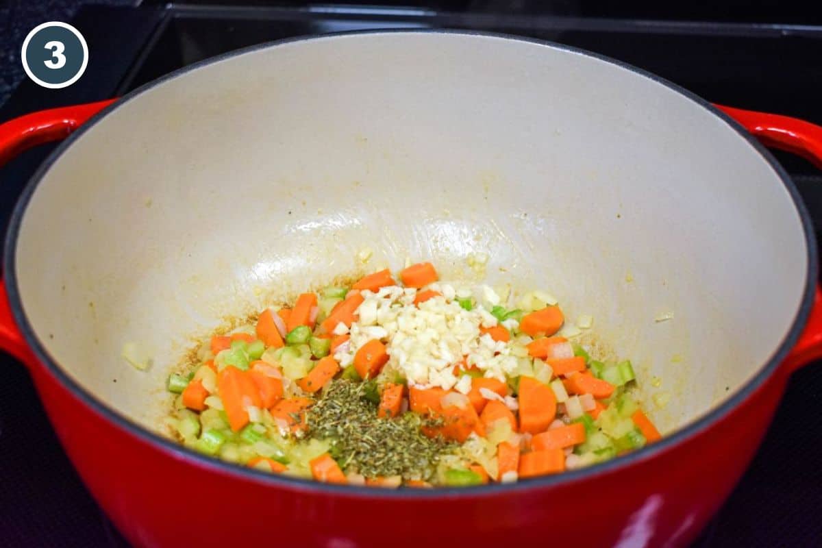 Garlic and dried herbs added to the sautéed vegetables.