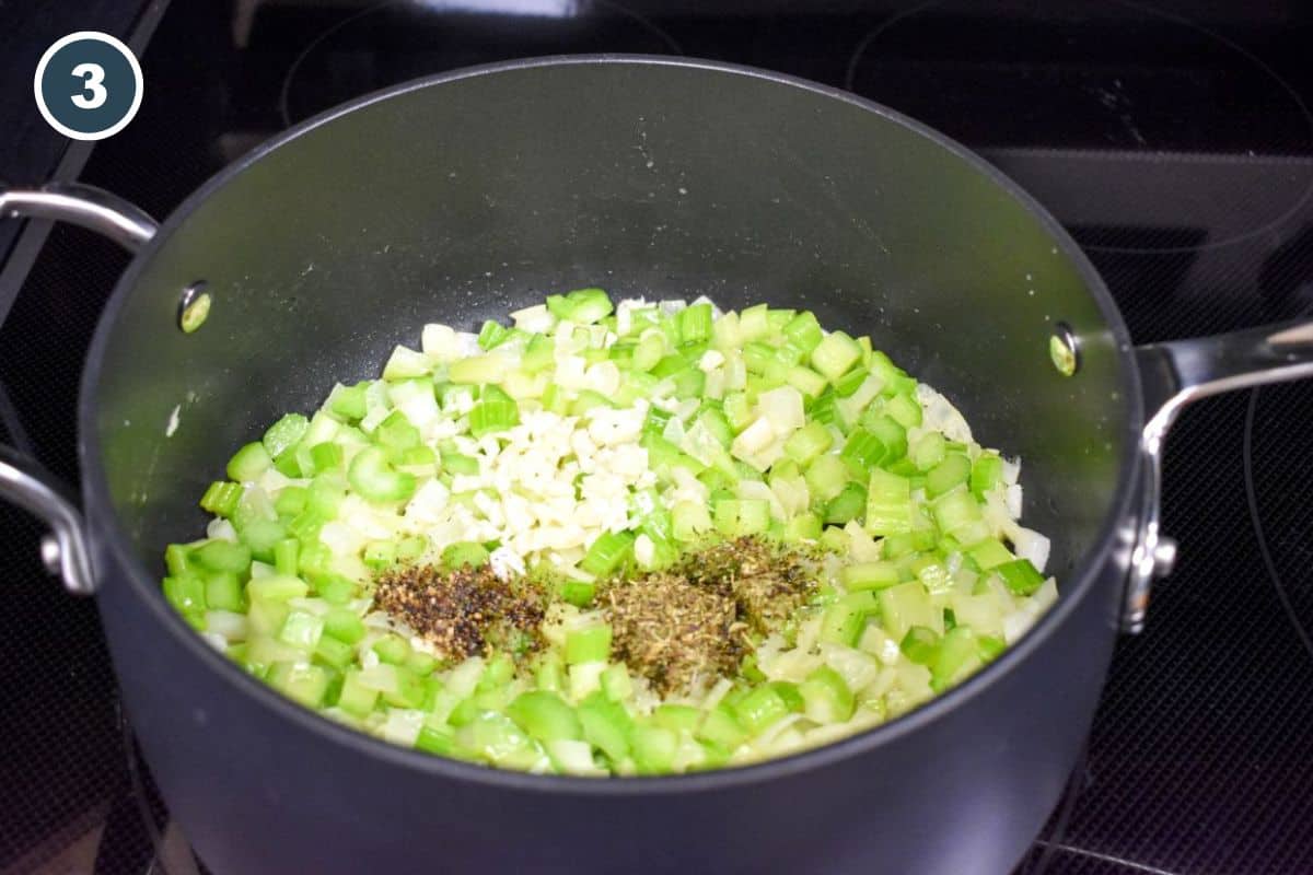 Garlic and seasonings added to sautéed celery and onions.
