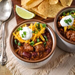 Steak chili topped with shredded cheddar cheese, sour cream, and green onions.